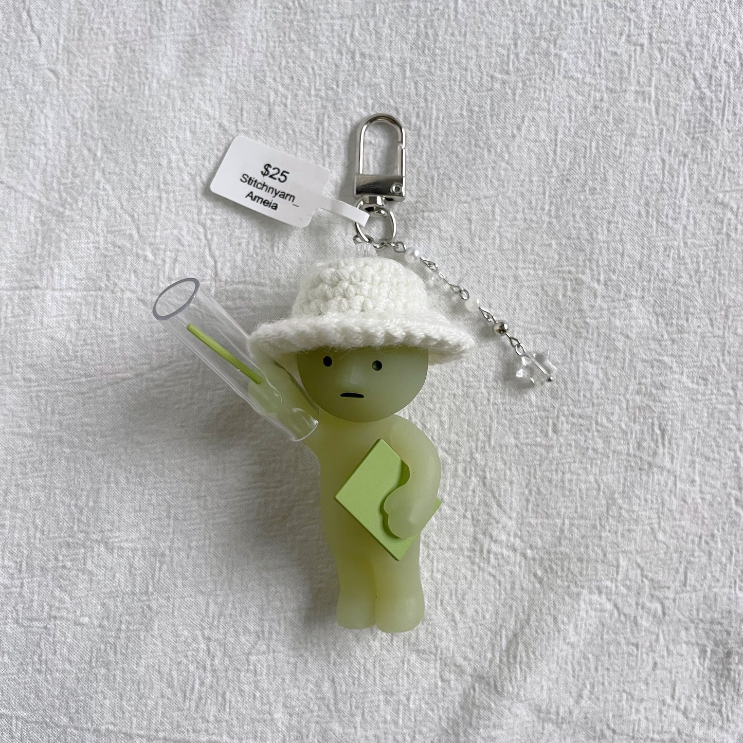 Smiski Presenting with White Hat Keychain