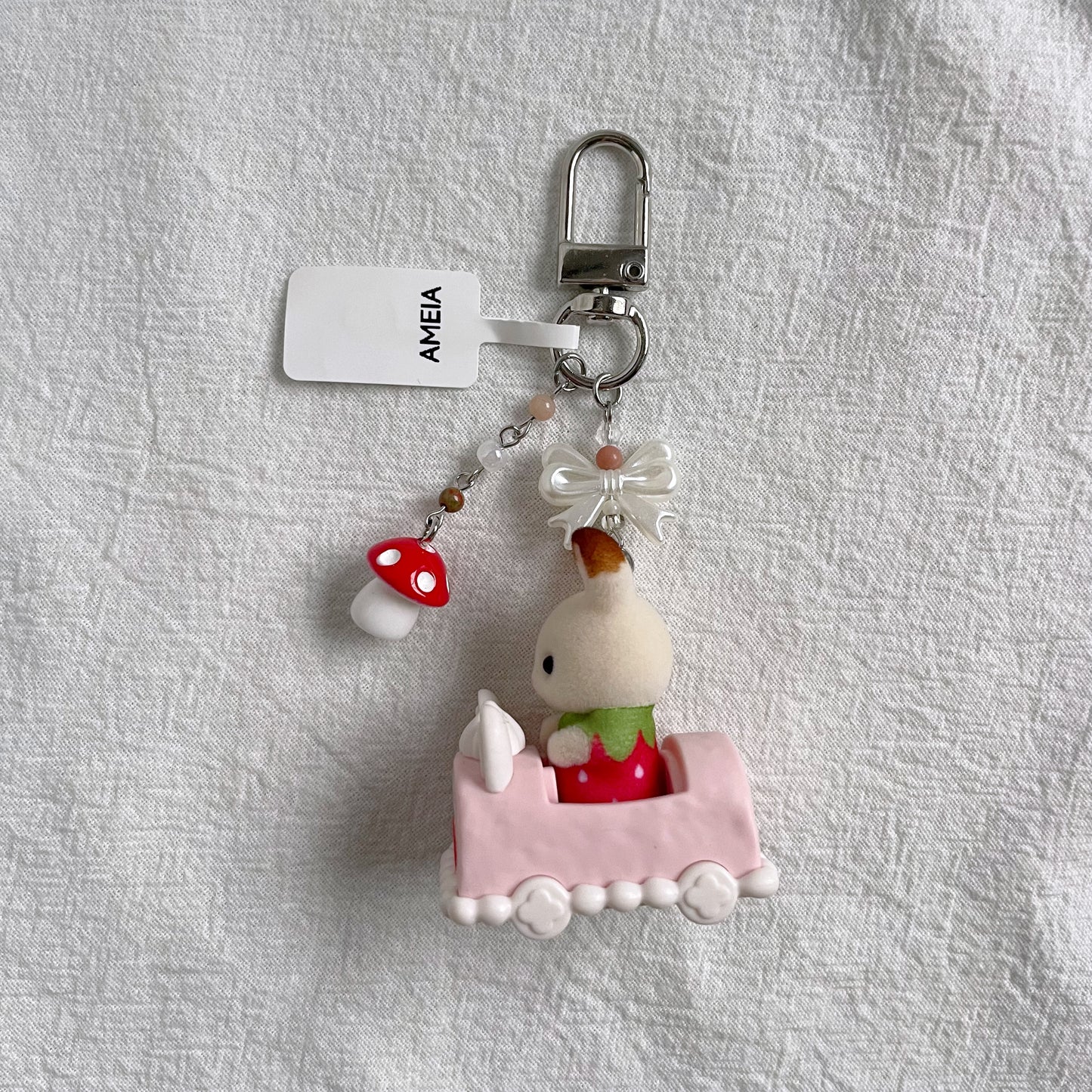 Chocolate Rabbit Baby in Cake Car Keychain